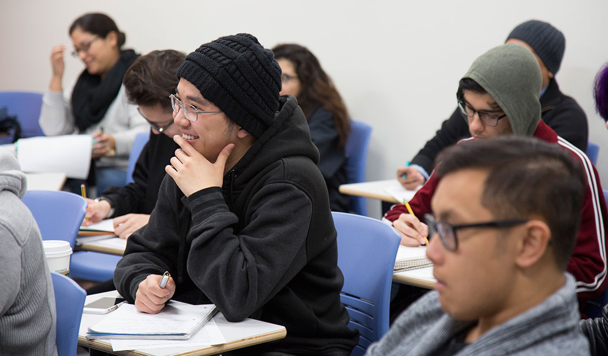 A student works in their Social Sciences class. 