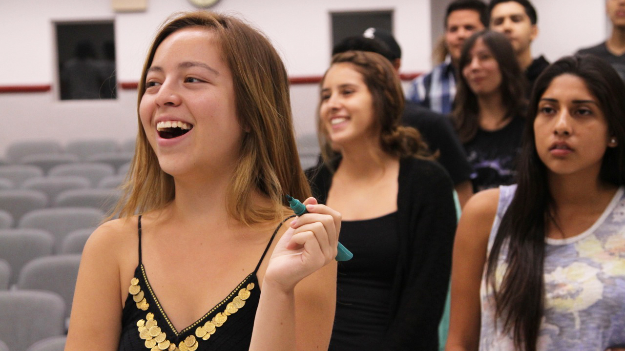 A group of students participate in a linguistics class.