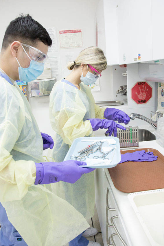 Dental Assisting students work in class.