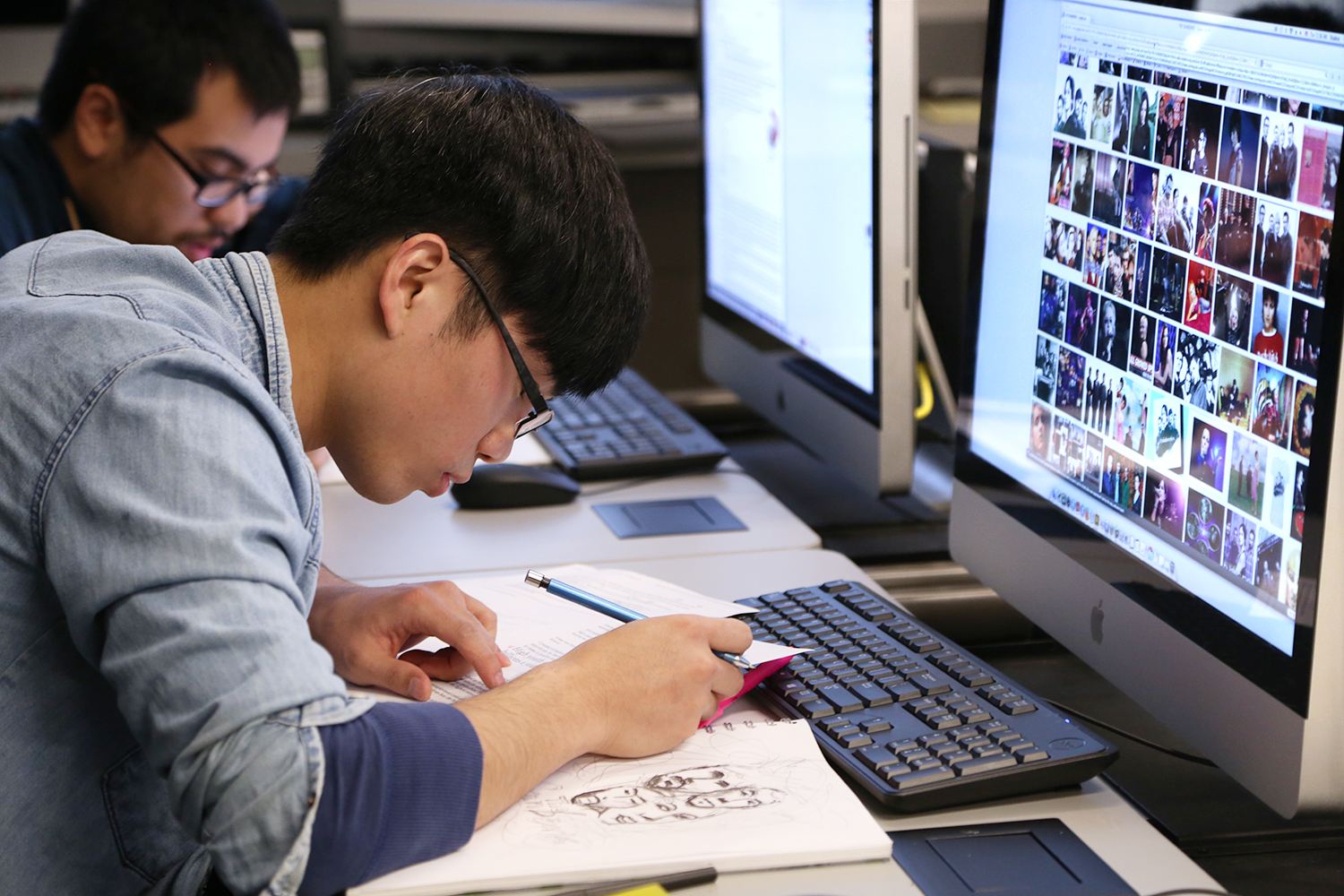 Students work in a graphic design class.