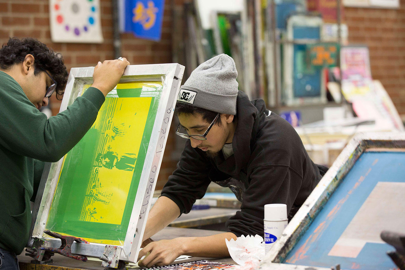 Students work during a screen printing course.
