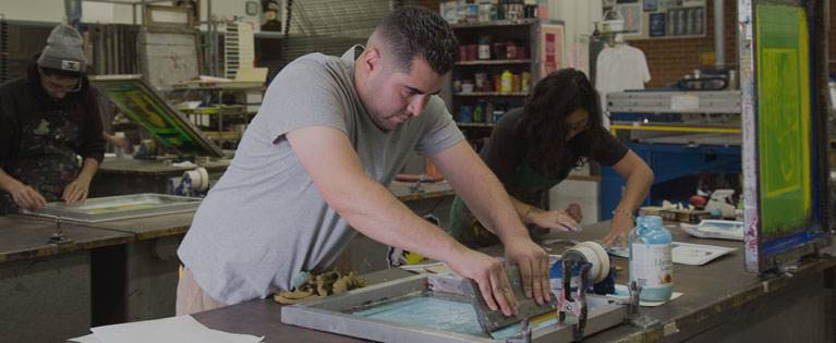 student works in screen printing class