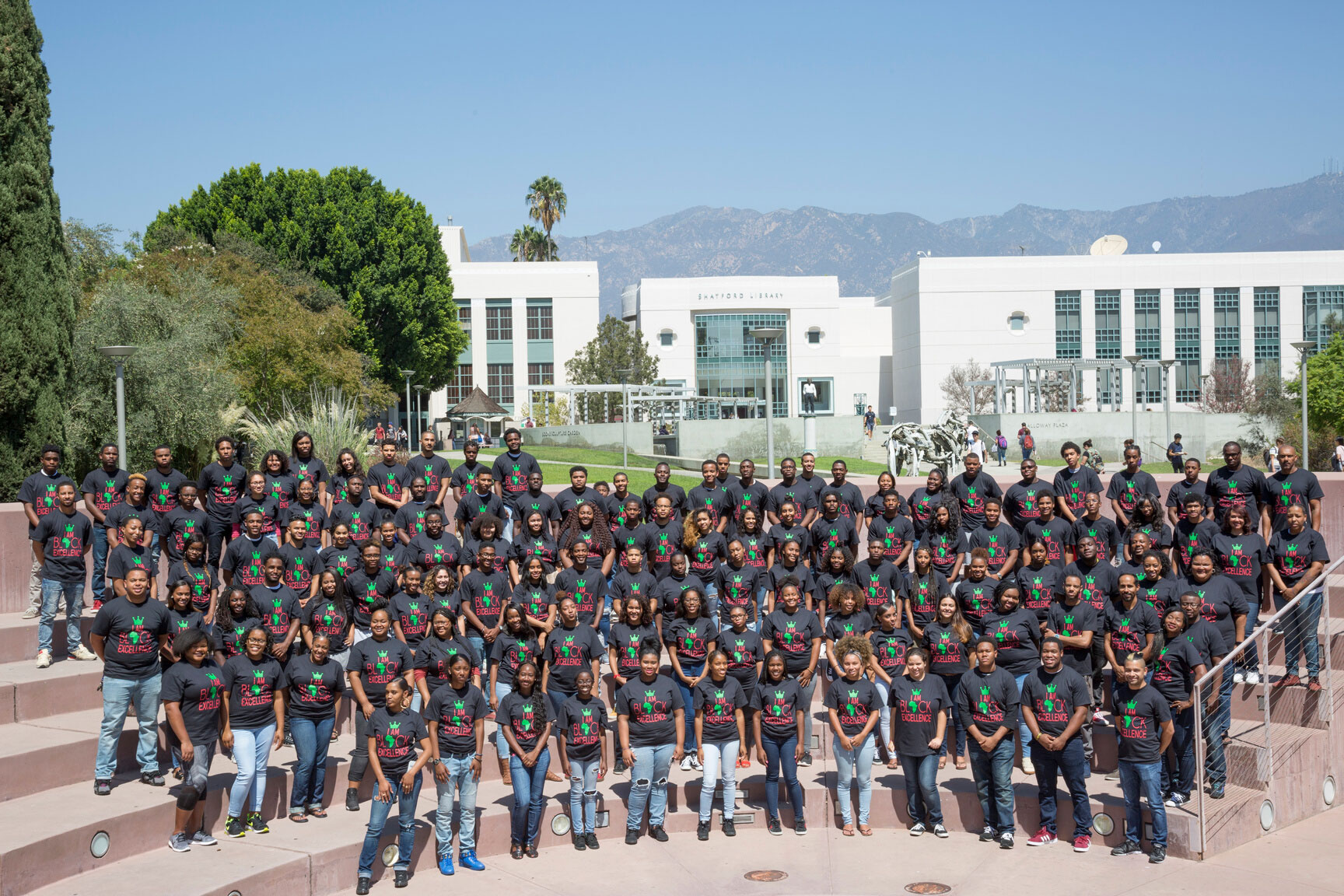 Ujima students stand in Ampitheatre on cmapus