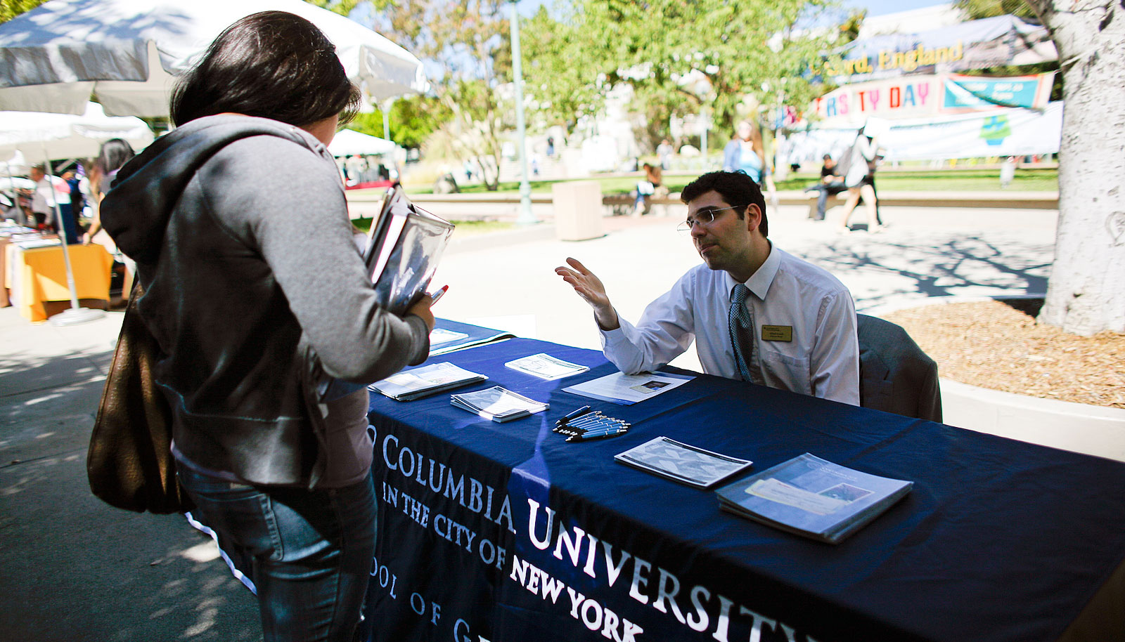 A student speaks with a representative from Columbia University.