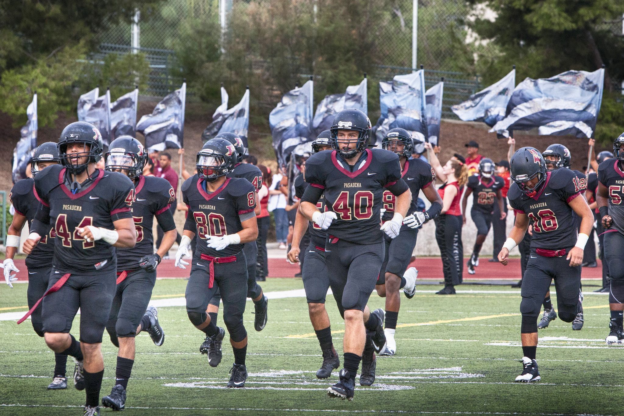 The PCC Footbal team takes the field.